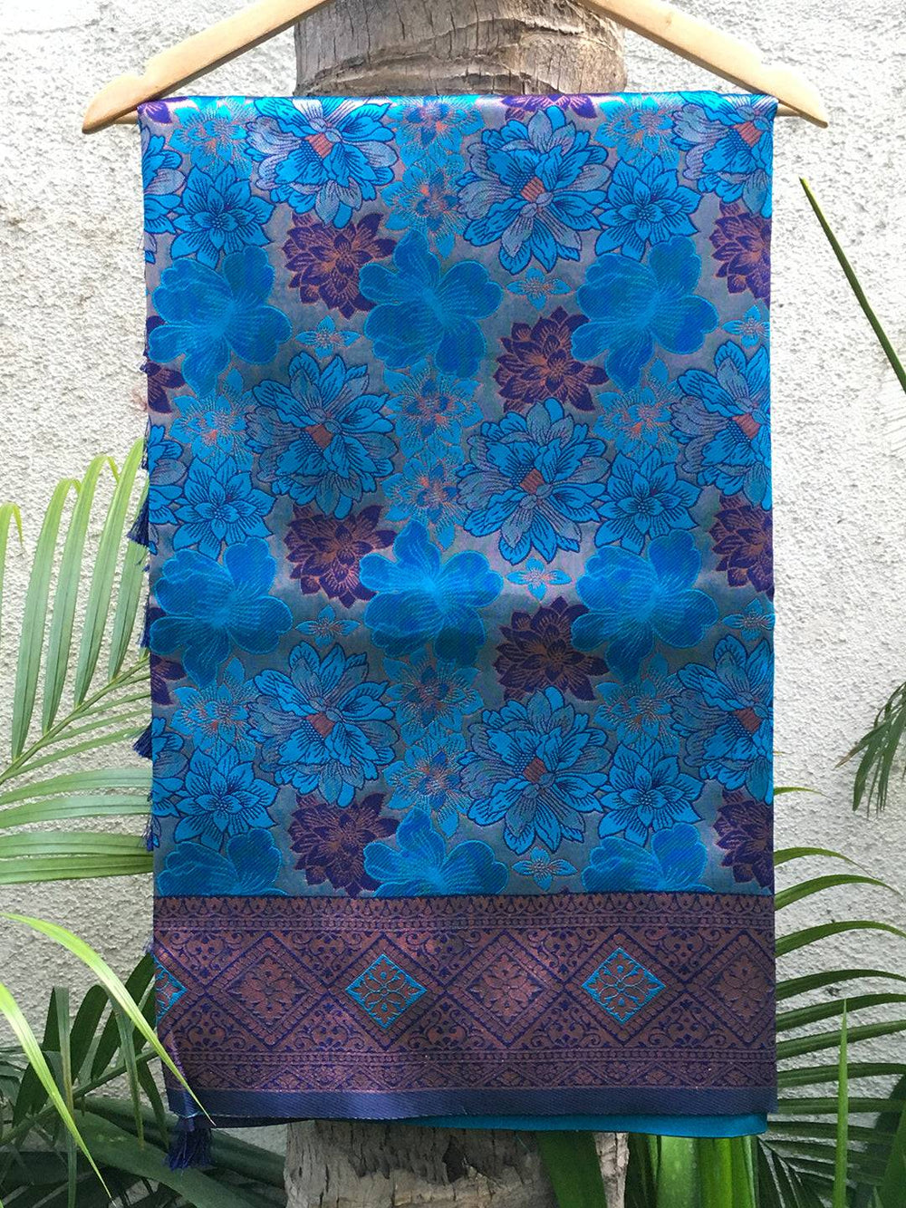 Royal blue soft silk butta weaving saree on hanger