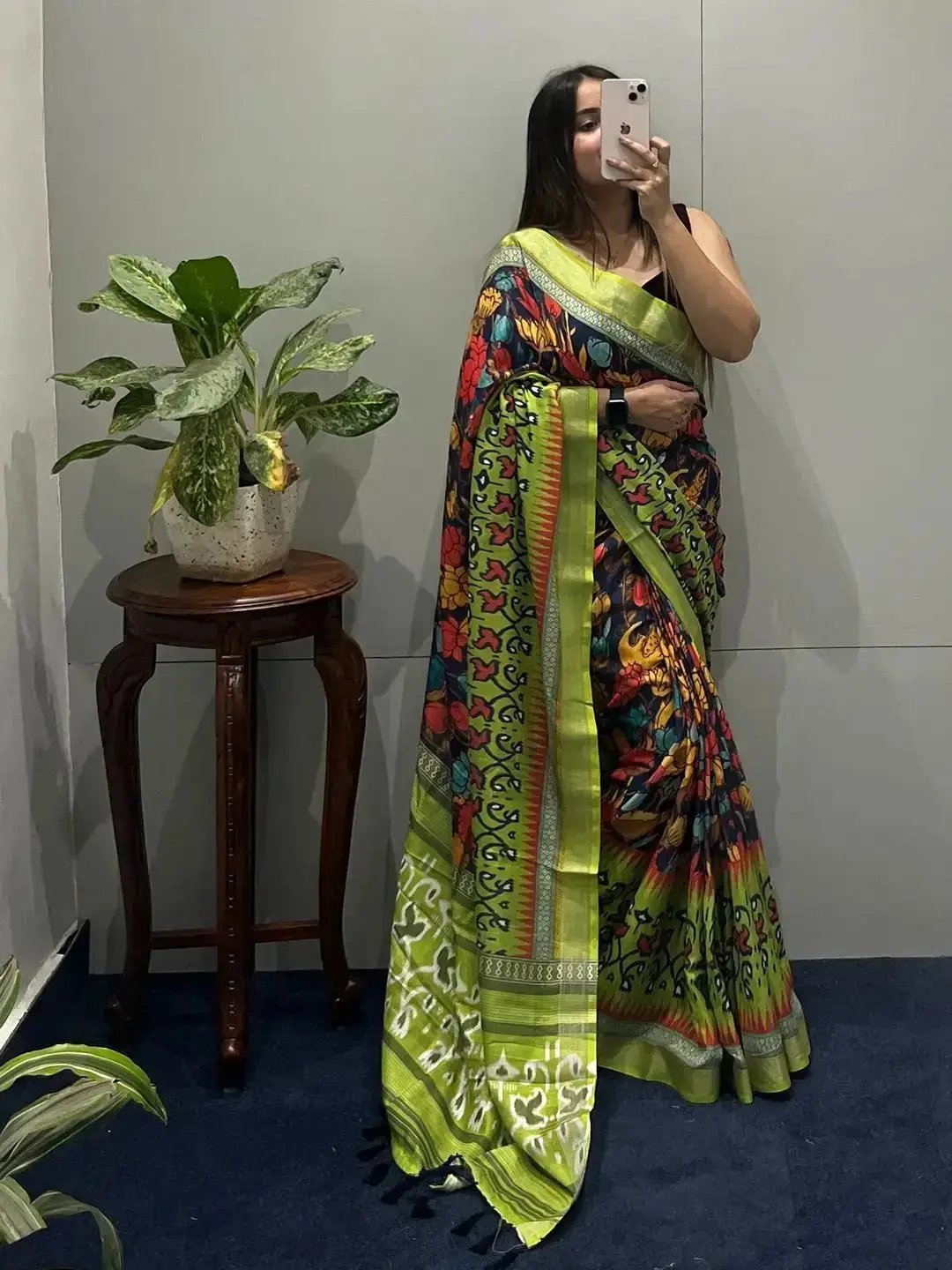 Mirror selfie of floral Ikkat saree with intricate patterns