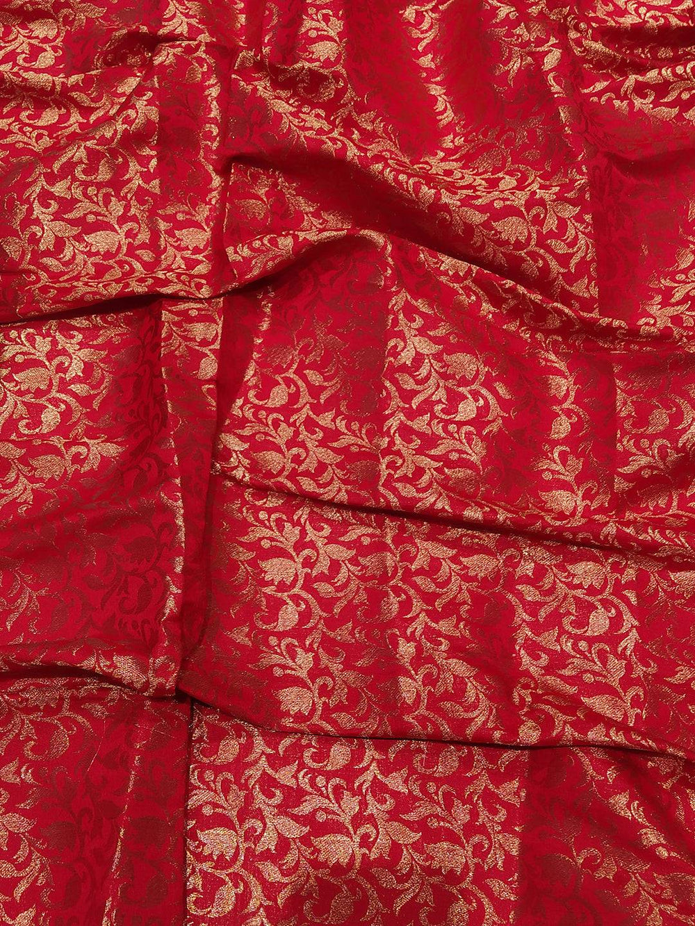 Close-up of red and gold Kanjivaram saree fabric design