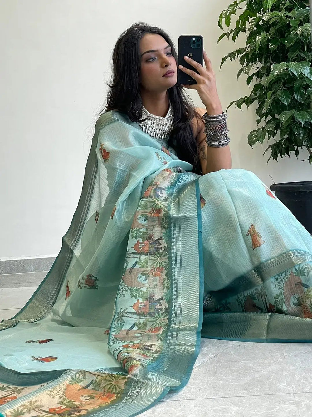 Traditional soft gold zari saree with detailed prints