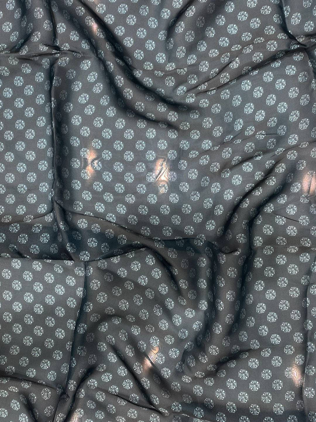 Close-up of dark blue patterned fabric with floral design
