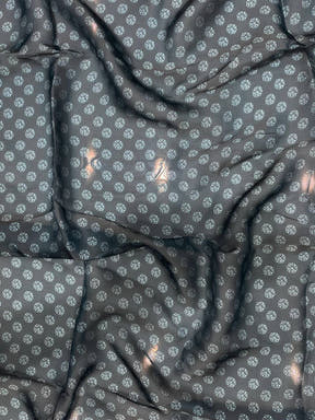 Close-up of dark blue patterned fabric with floral design