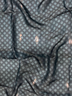 Close-up of dark blue patterned fabric with floral design