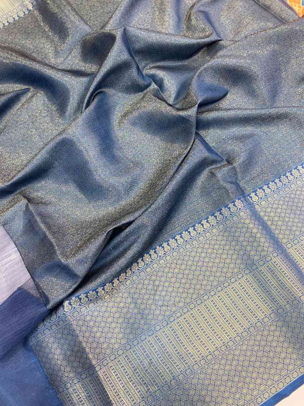 Close-up of Moonga silk saree with detailed Patola print border