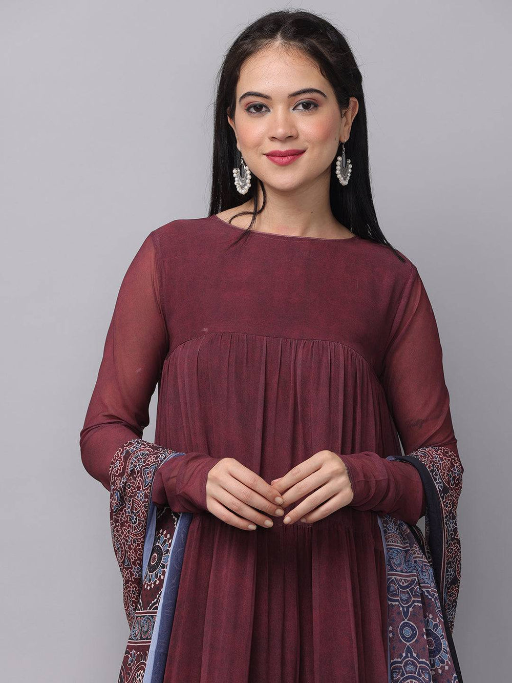 Close-up of mulberry dress with floral dupatta