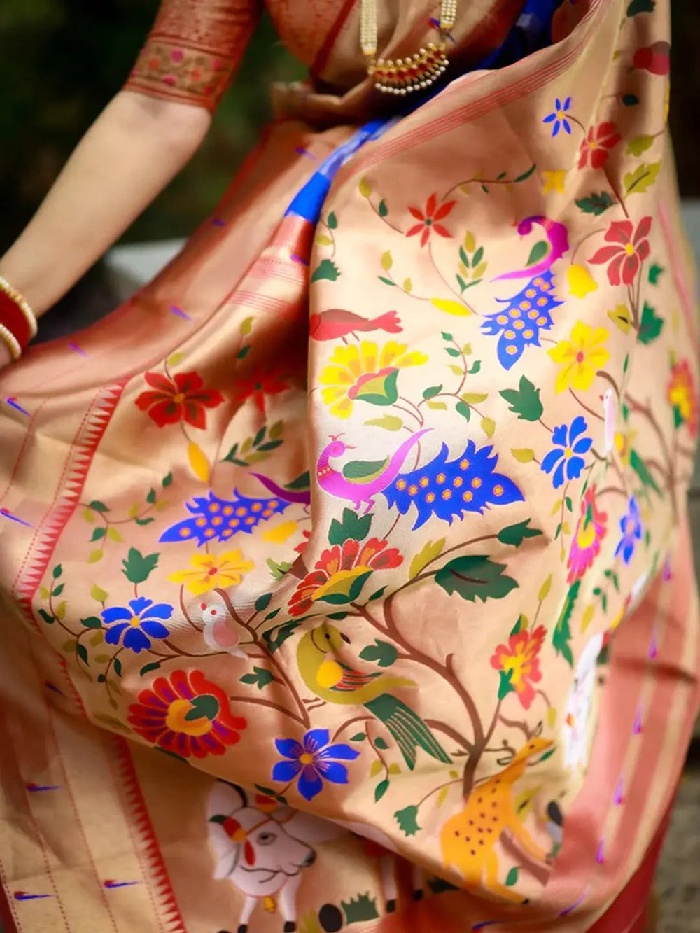 Close-up of pichwai woven design on Paithani silk saree