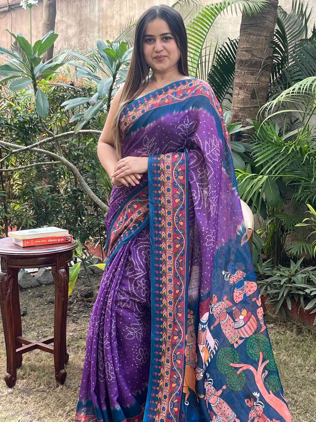 Purple linen saree featuring Bandhej and Kalamkari print, outdoor