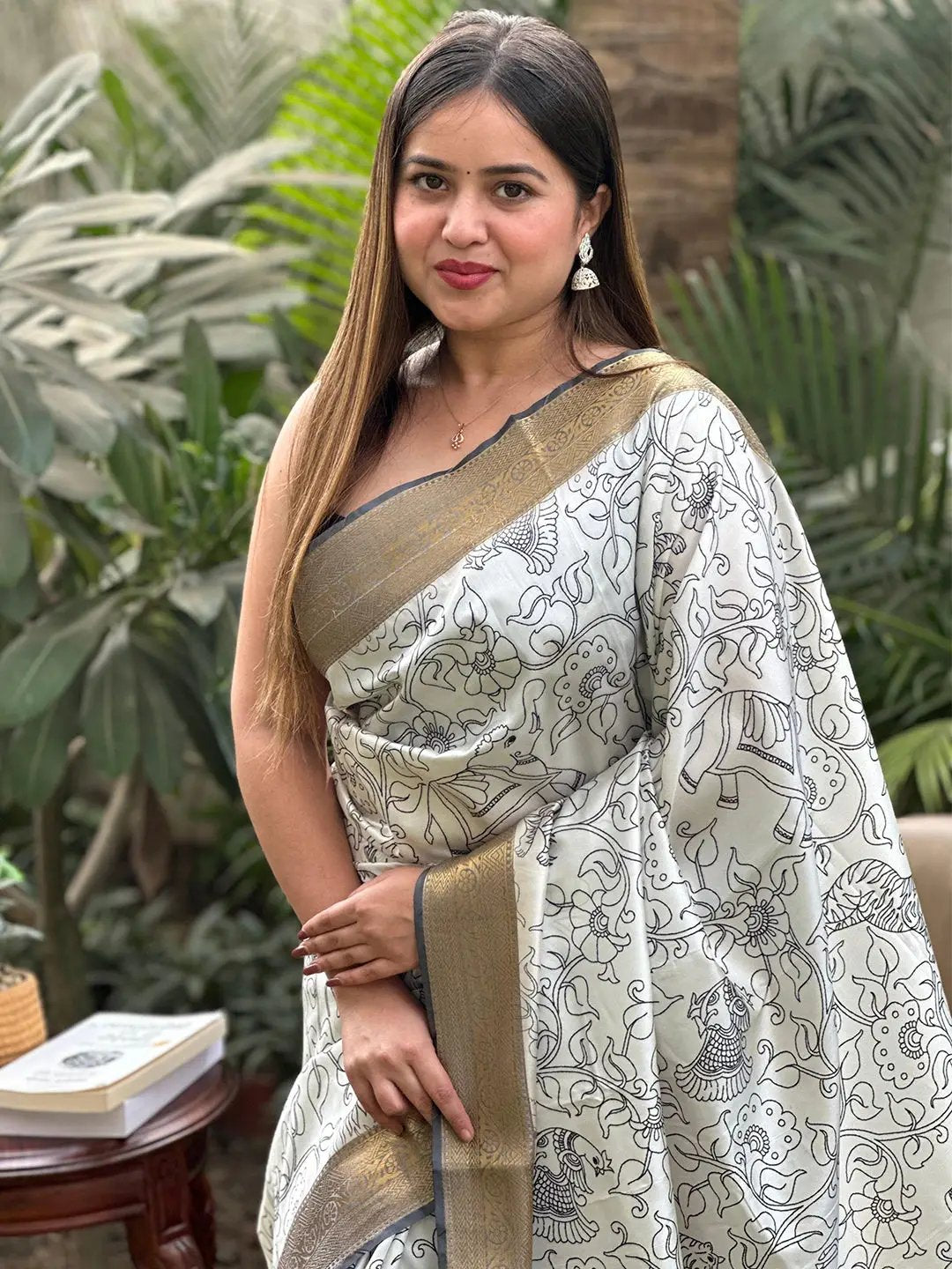 Model wearing Kalamkari saree with block print and zari