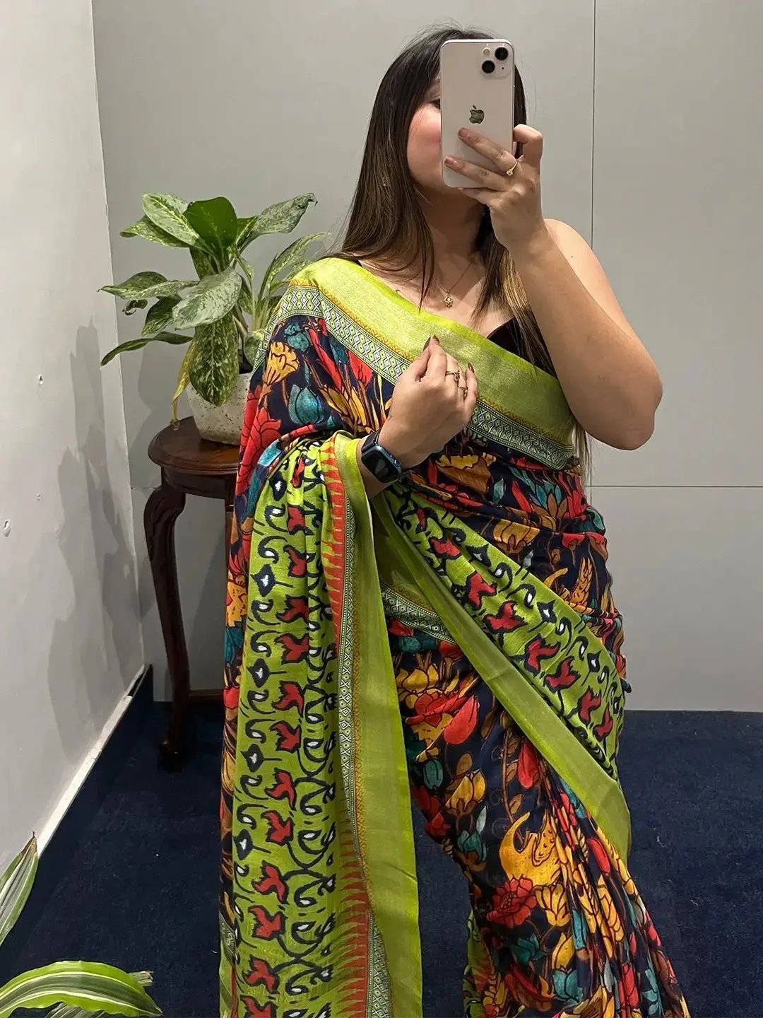 Detailed view of floral Ikkat saree with green and red design