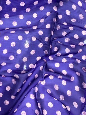 Close-up of purple polka dot blouse fabric