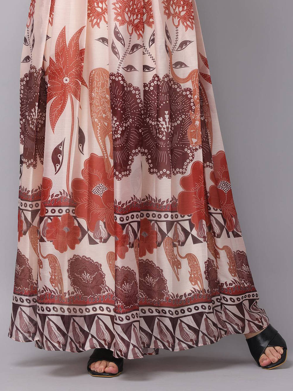 Detailed view of blush cream floral print dress hem