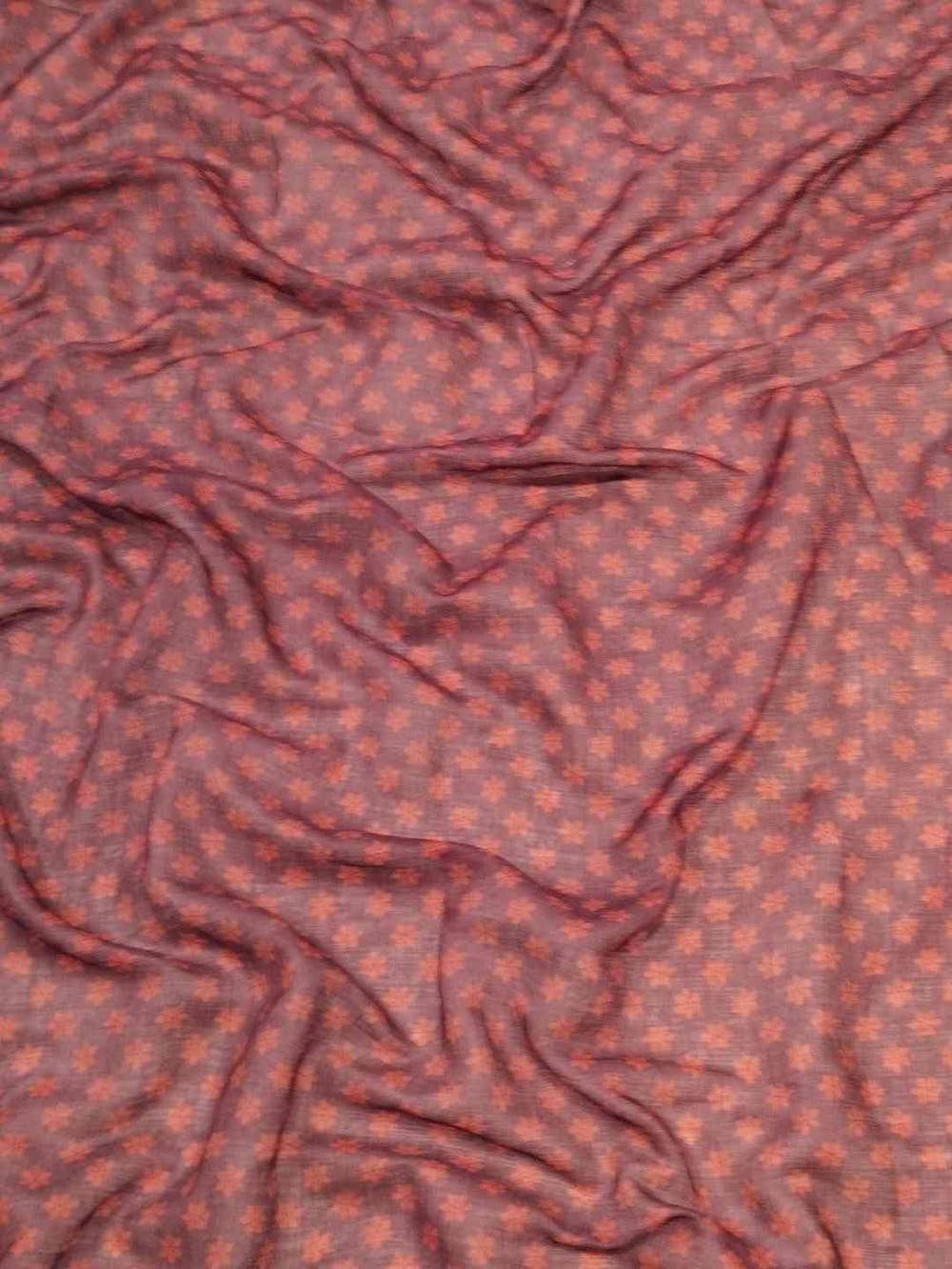 Close-up of fabric with intricate kalamkari print design