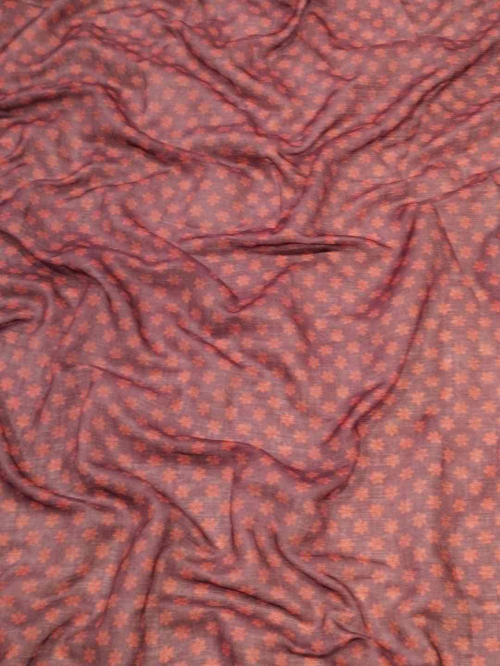 Close-up of fabric with intricate kalamkari print design