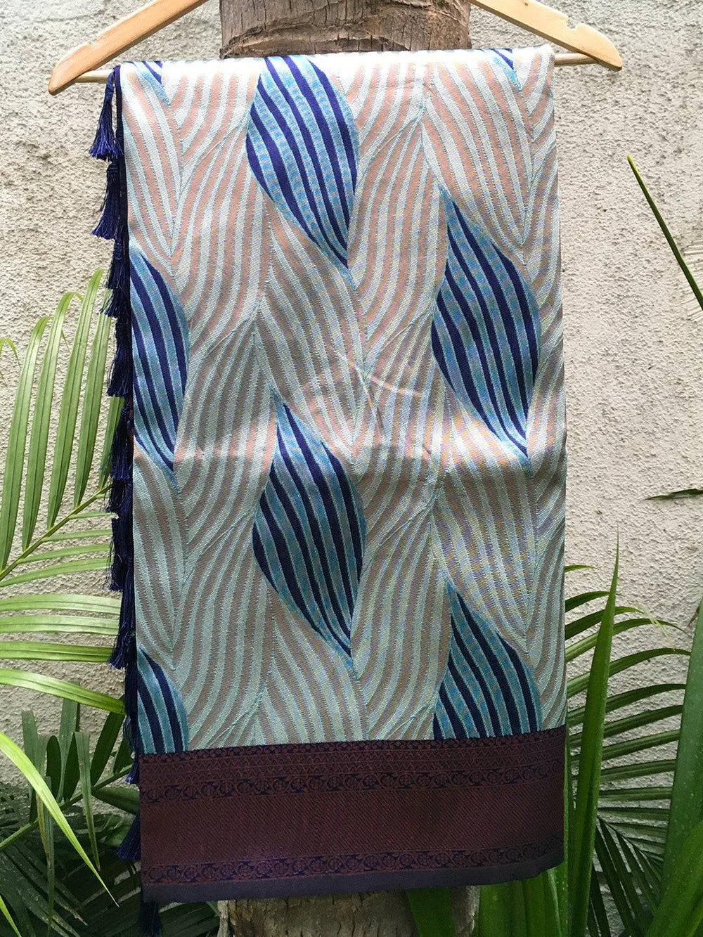 Sky blue Tussar silk Ikkat saree with abstract print on hanger.