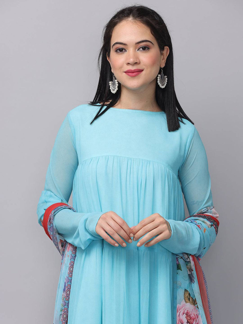 Close-up of powder blue dress with dupatta, smiling model