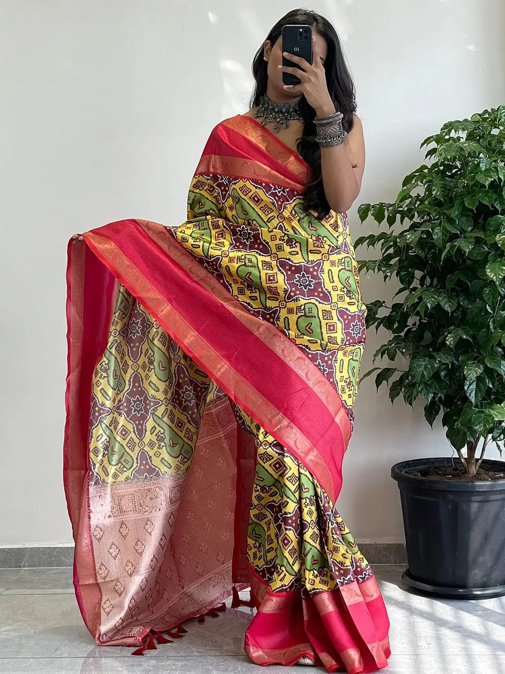 Traditional soft silk saree featuring Gadwal border design.