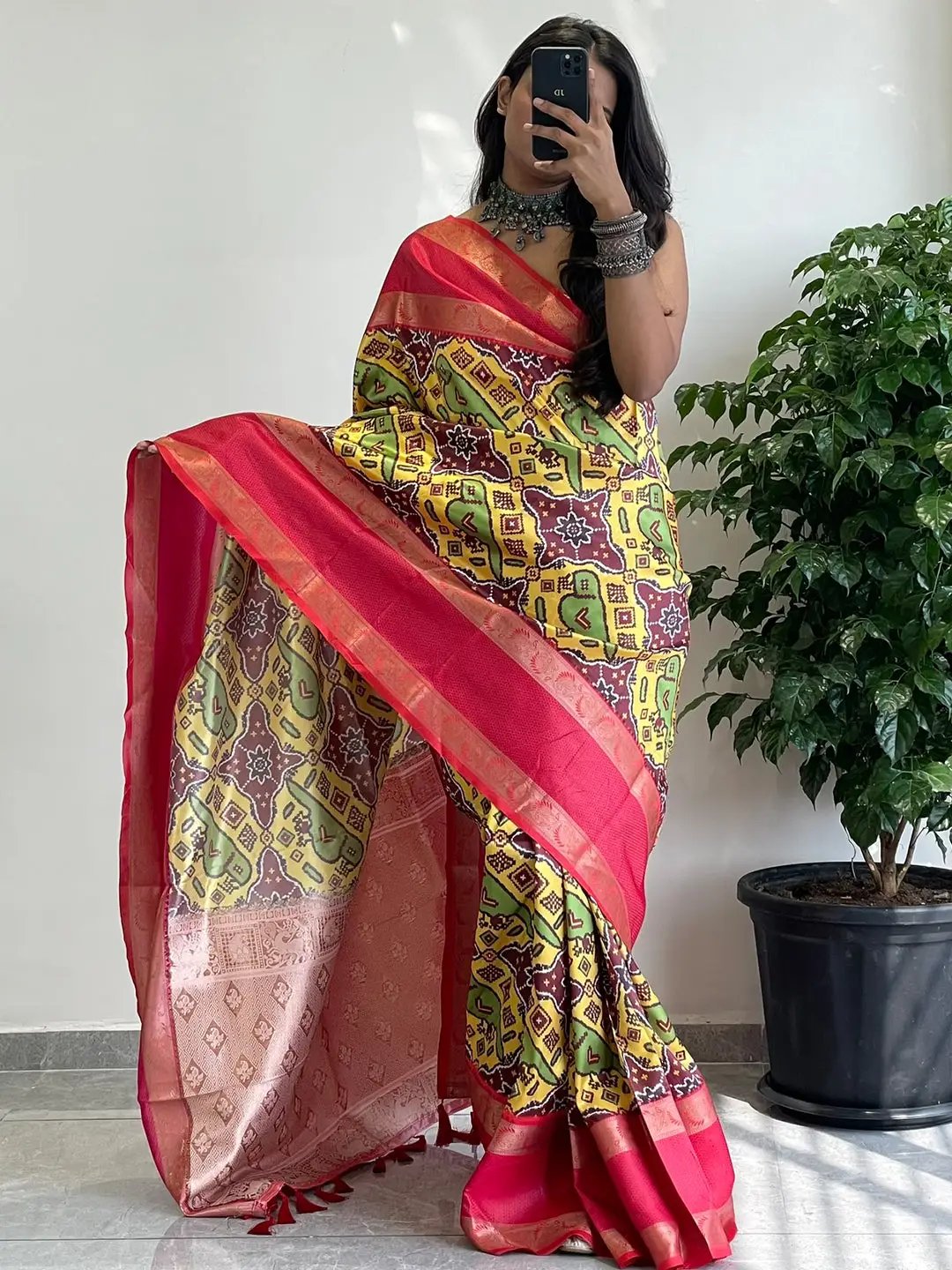 Traditional soft silk saree featuring Gadwal border design.