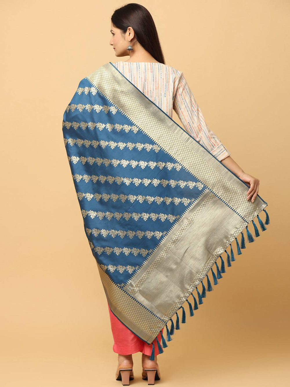 Back view of teal woven design dupatta with tassels