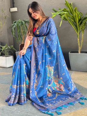 Blue linen saree showcasing digital print and detailed border