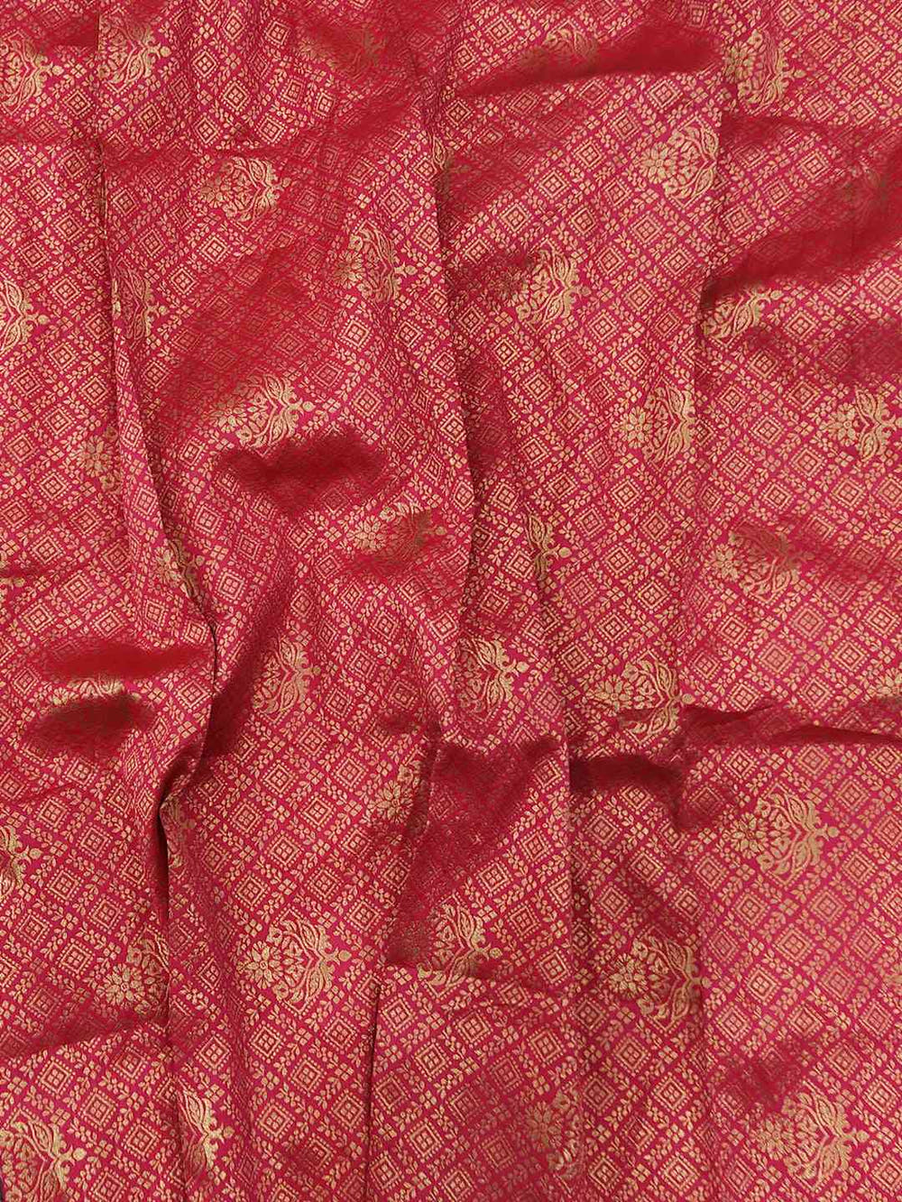 Red fabric with intricate gold thread weaving pattern