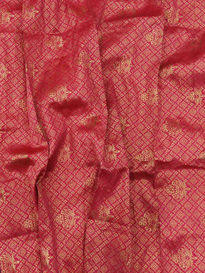 Red fabric with intricate gold thread weaving pattern