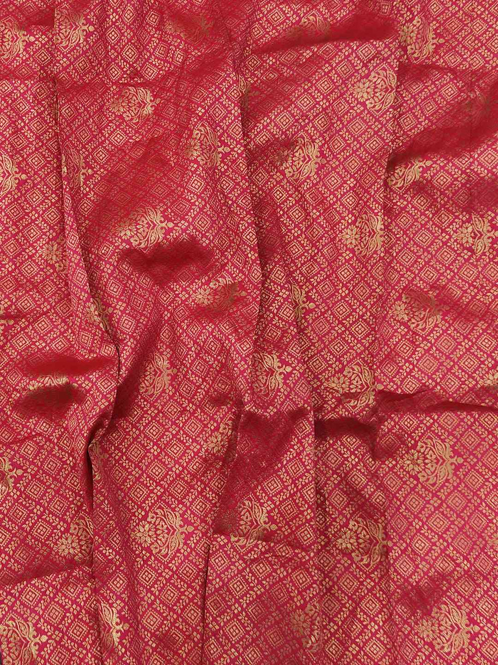 Red fabric with intricate gold thread weaving pattern