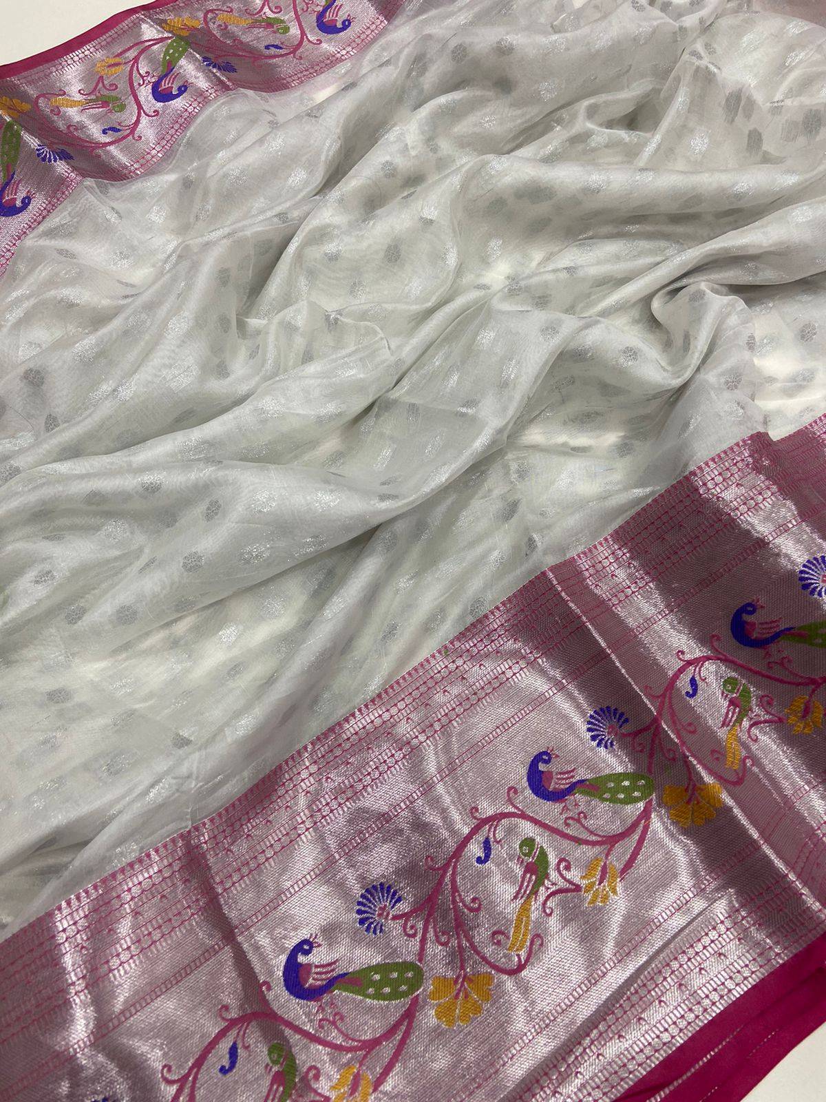 White pink organza saree with intricate silver zari and floral design