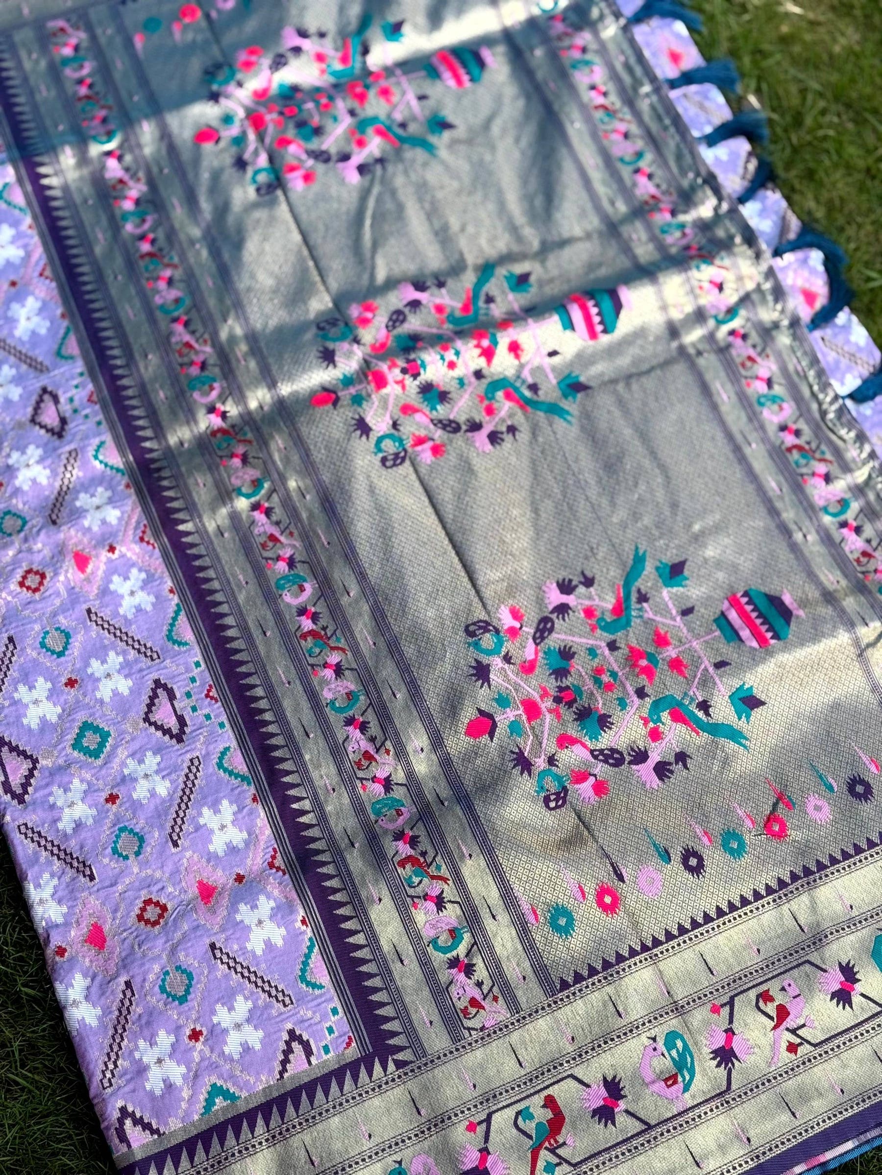 Lavender Patola silk saree with colorful embroidery and tassels