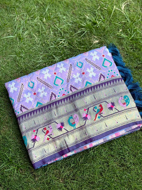 Light lavender Patola silk saree with intricate embroidery and tassels