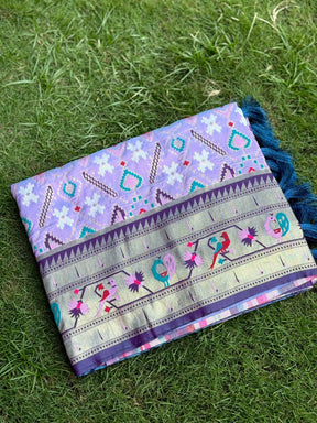 Light lavender Patola silk saree with intricate embroidery and tassels