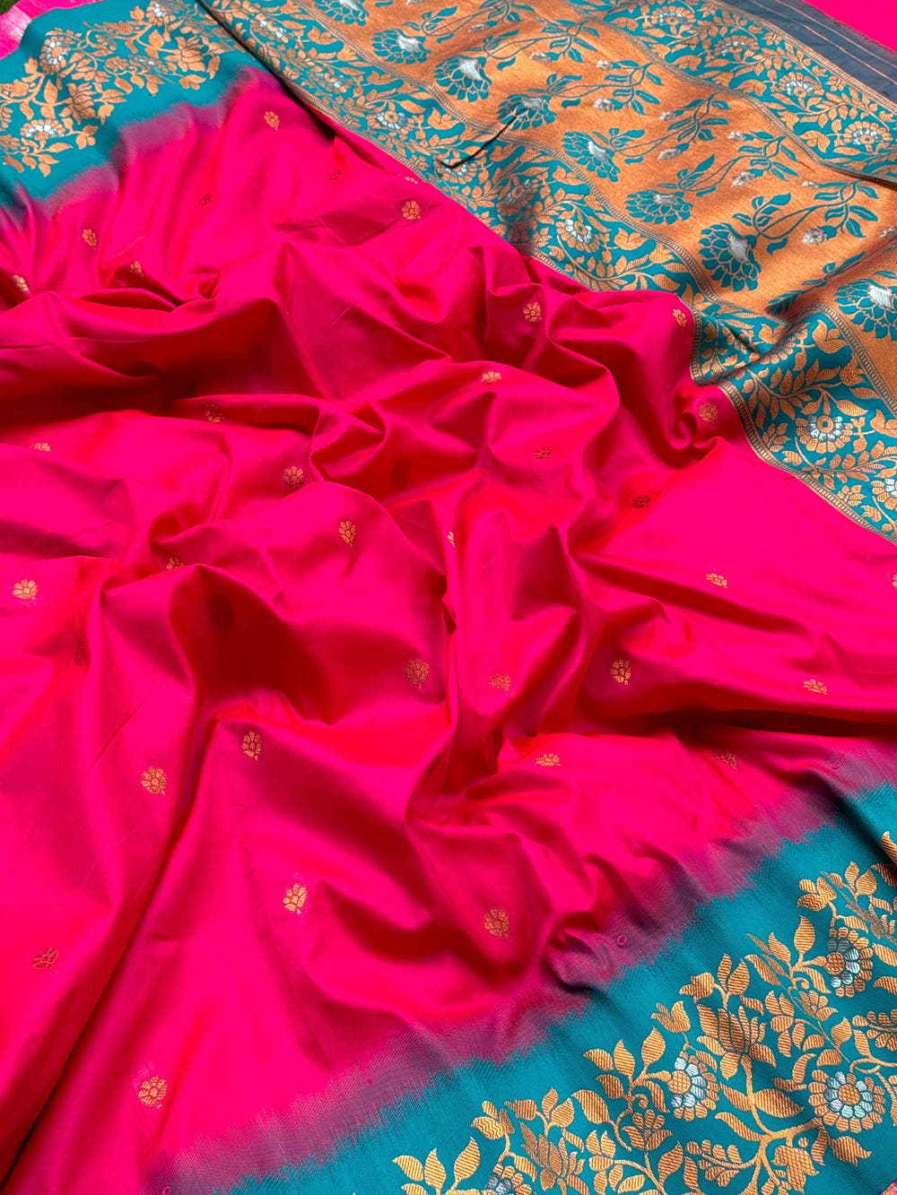 Close-up of Pink Silk Saree with Gold Floral Border