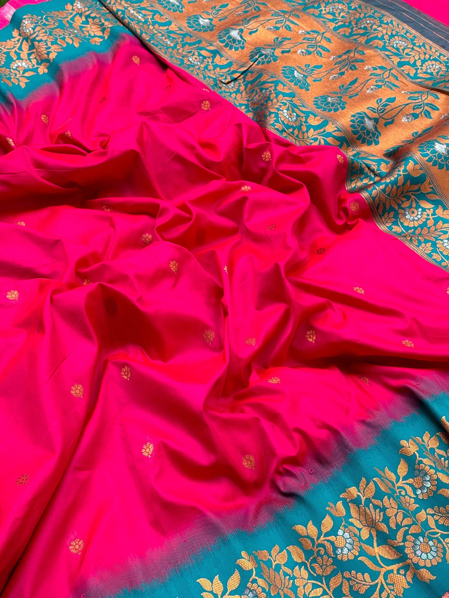 Close-up of Pink Silk Saree with Gold Floral Border