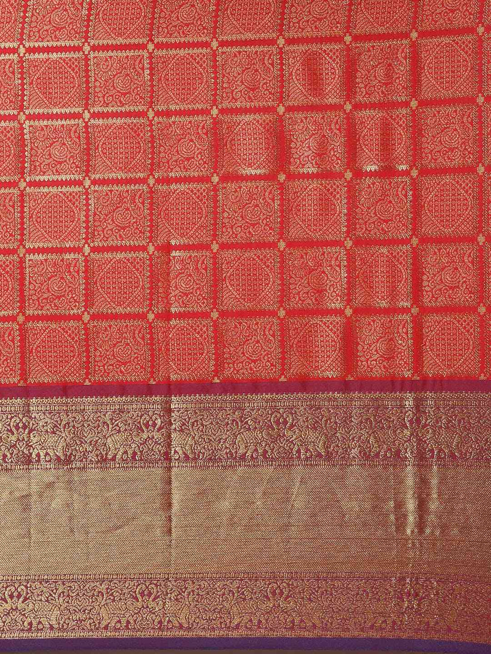 Detailed view of red checked print on Kanjivaram saree