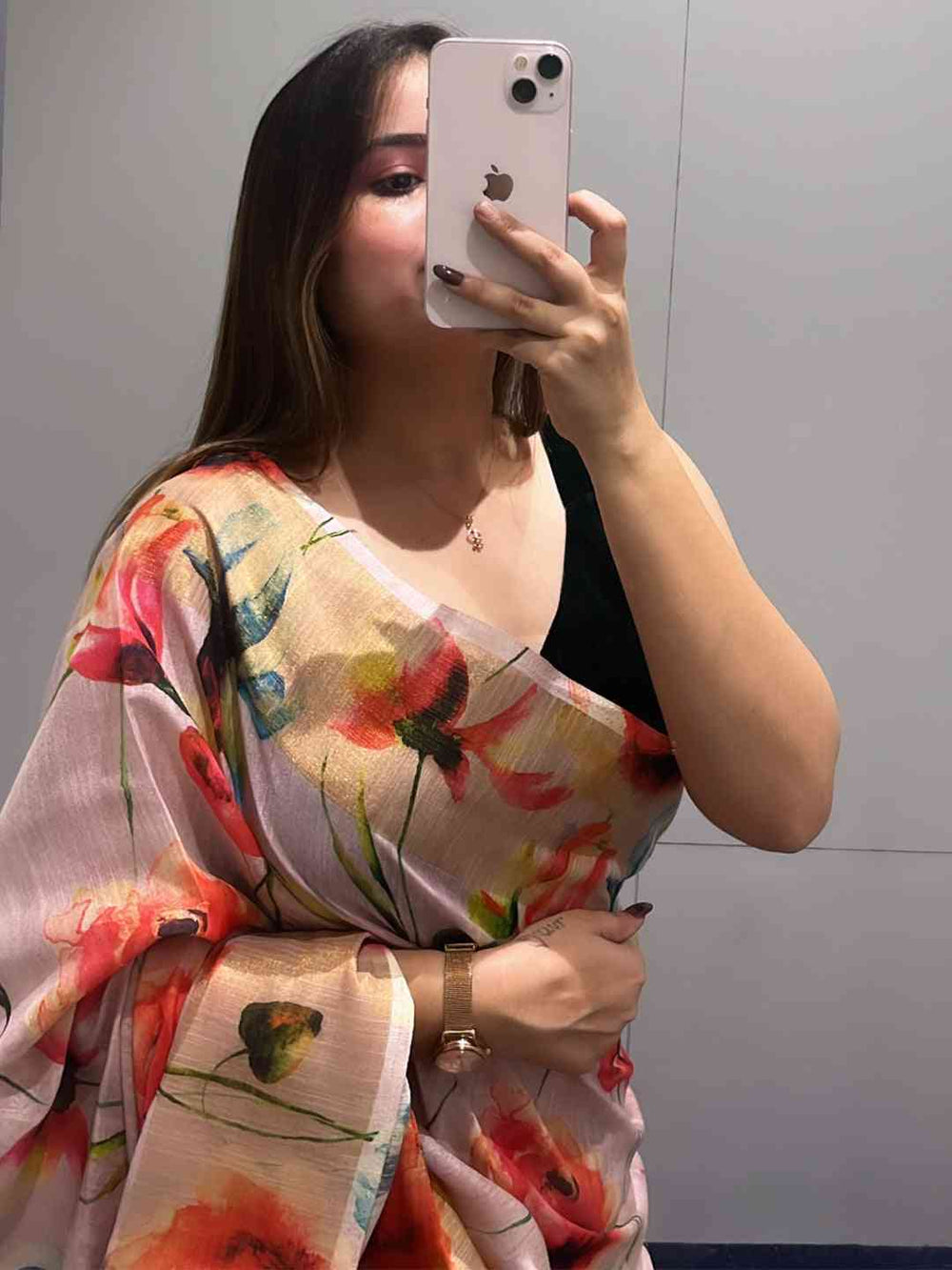 Model wearing Floral Elegance Pure Linen Saree with phone