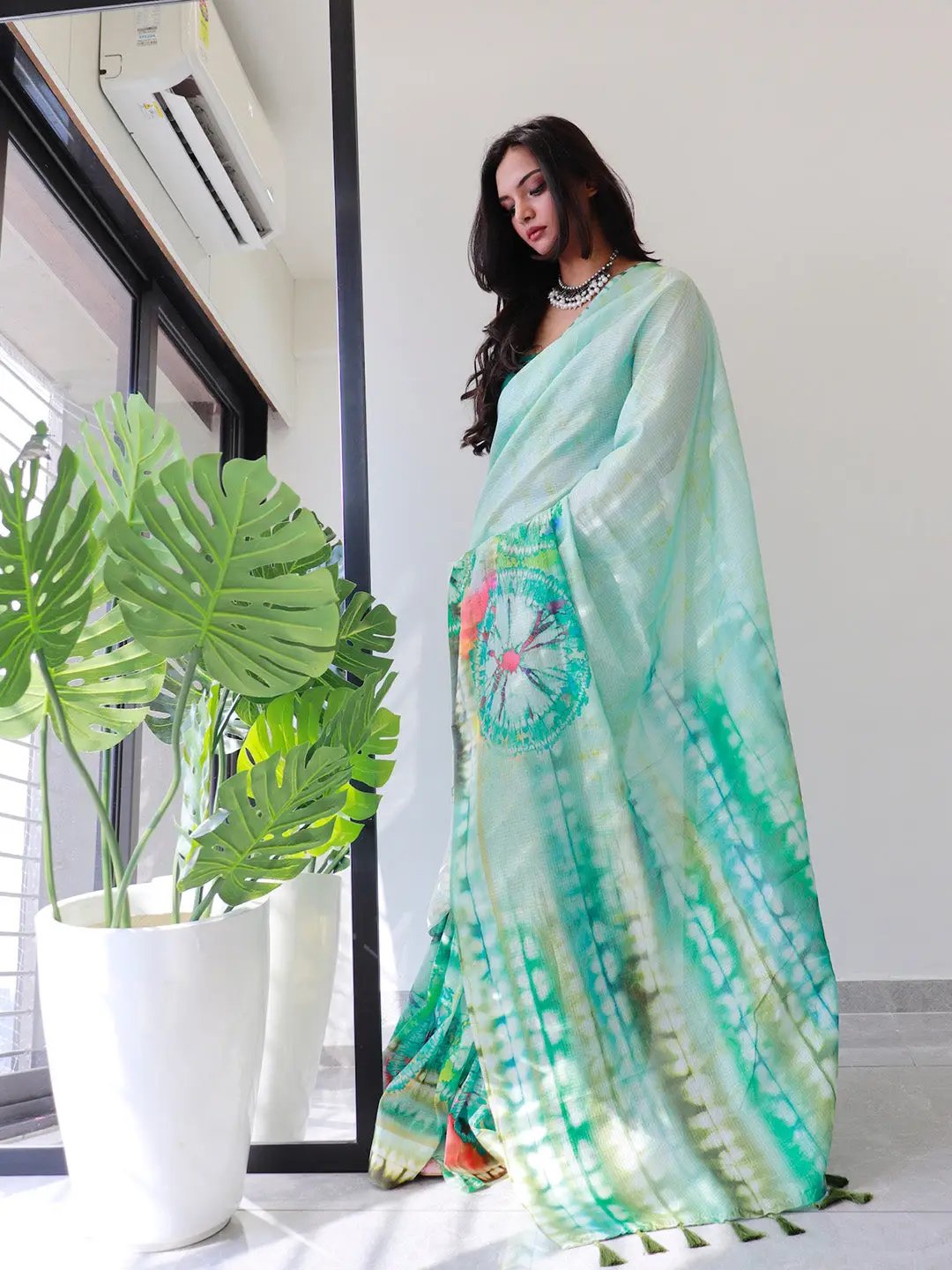 Stylish sea green tie dye satin Kota Doriya saree with vibrant patterns