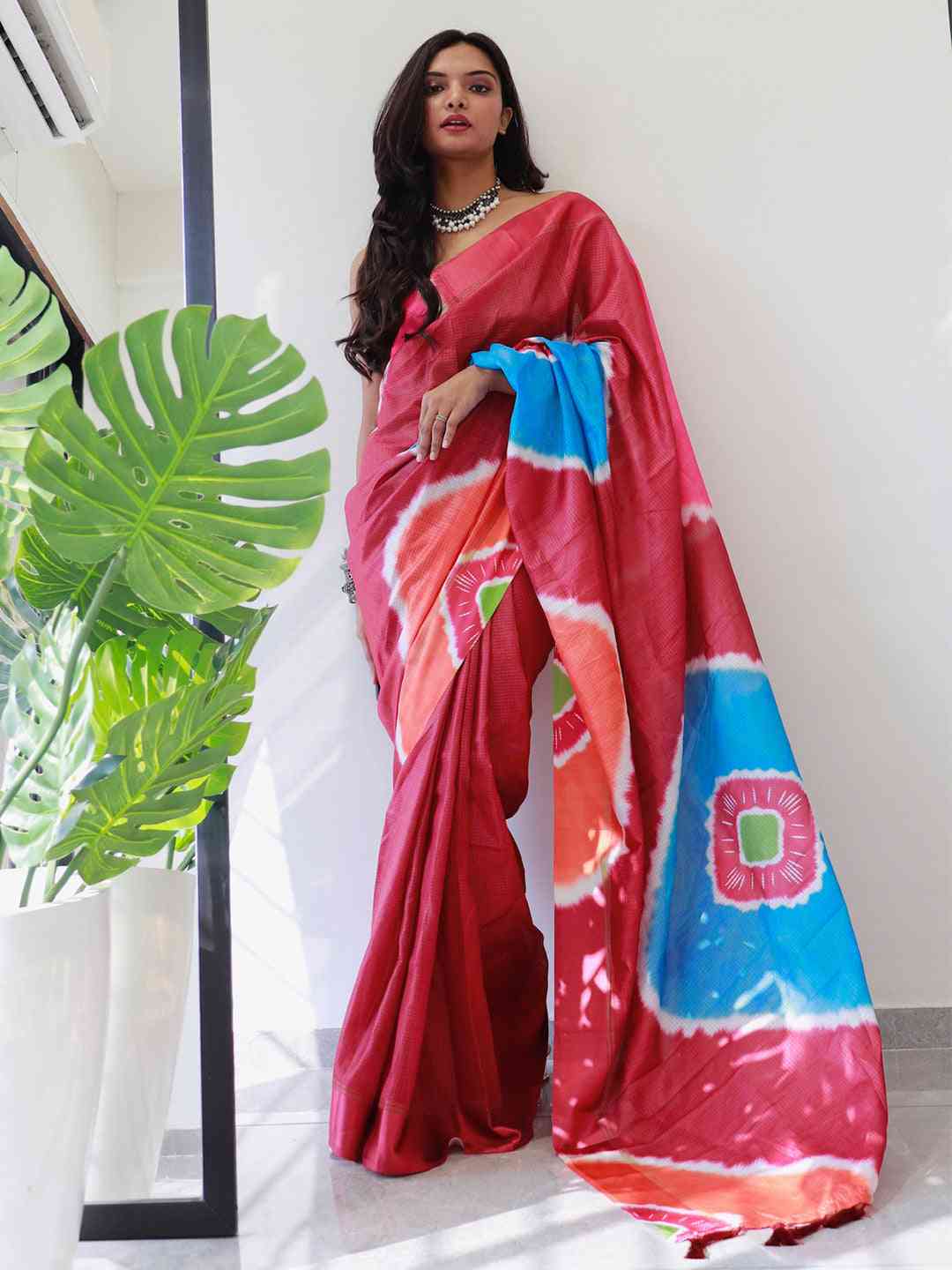 Party wear red satin saree with vibrant tie dye design