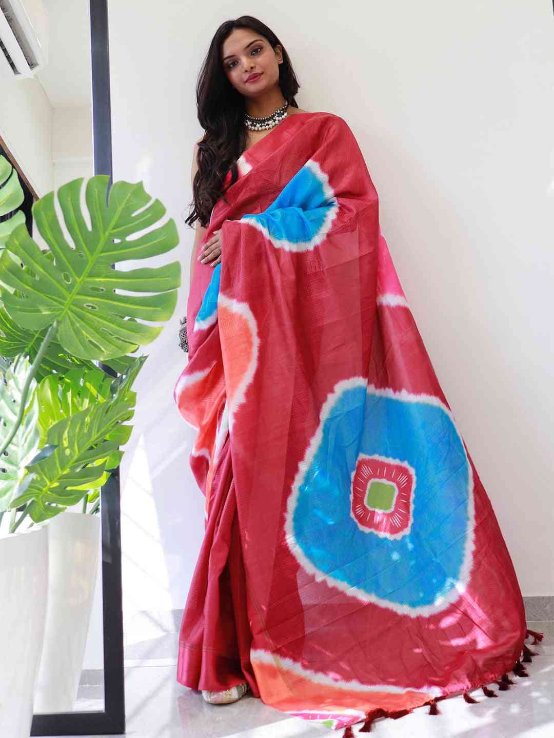 Stylish red Kota Doriya saree featuring colorful patterns
