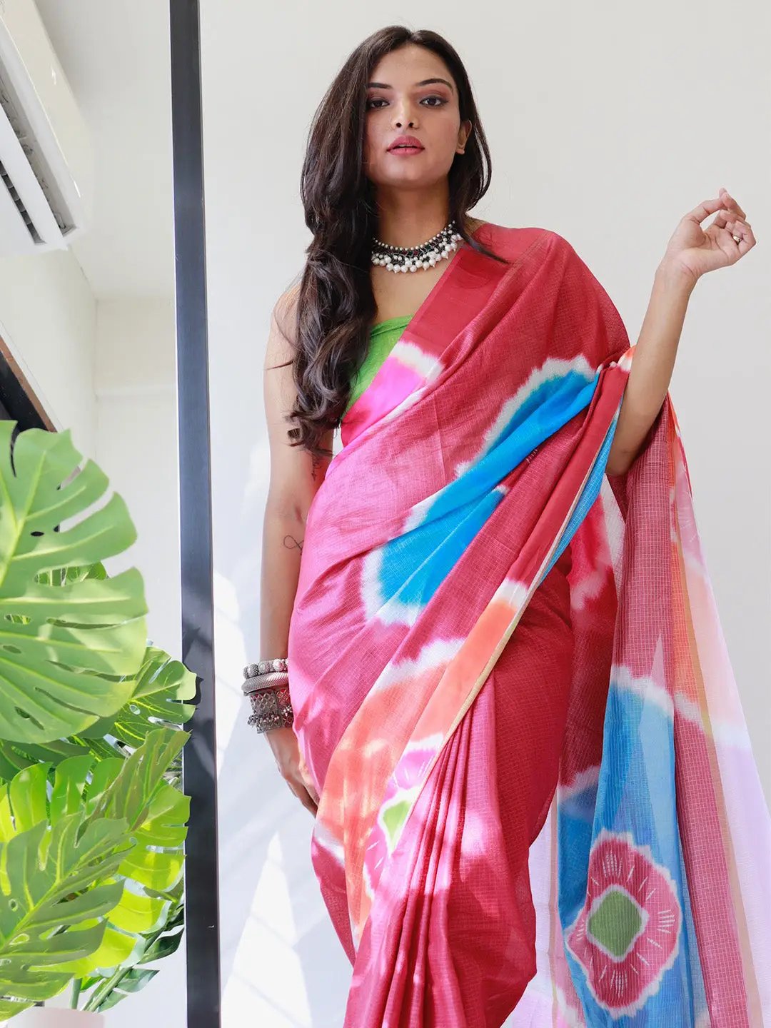 Red satin saree with striking blue and pink tie dye