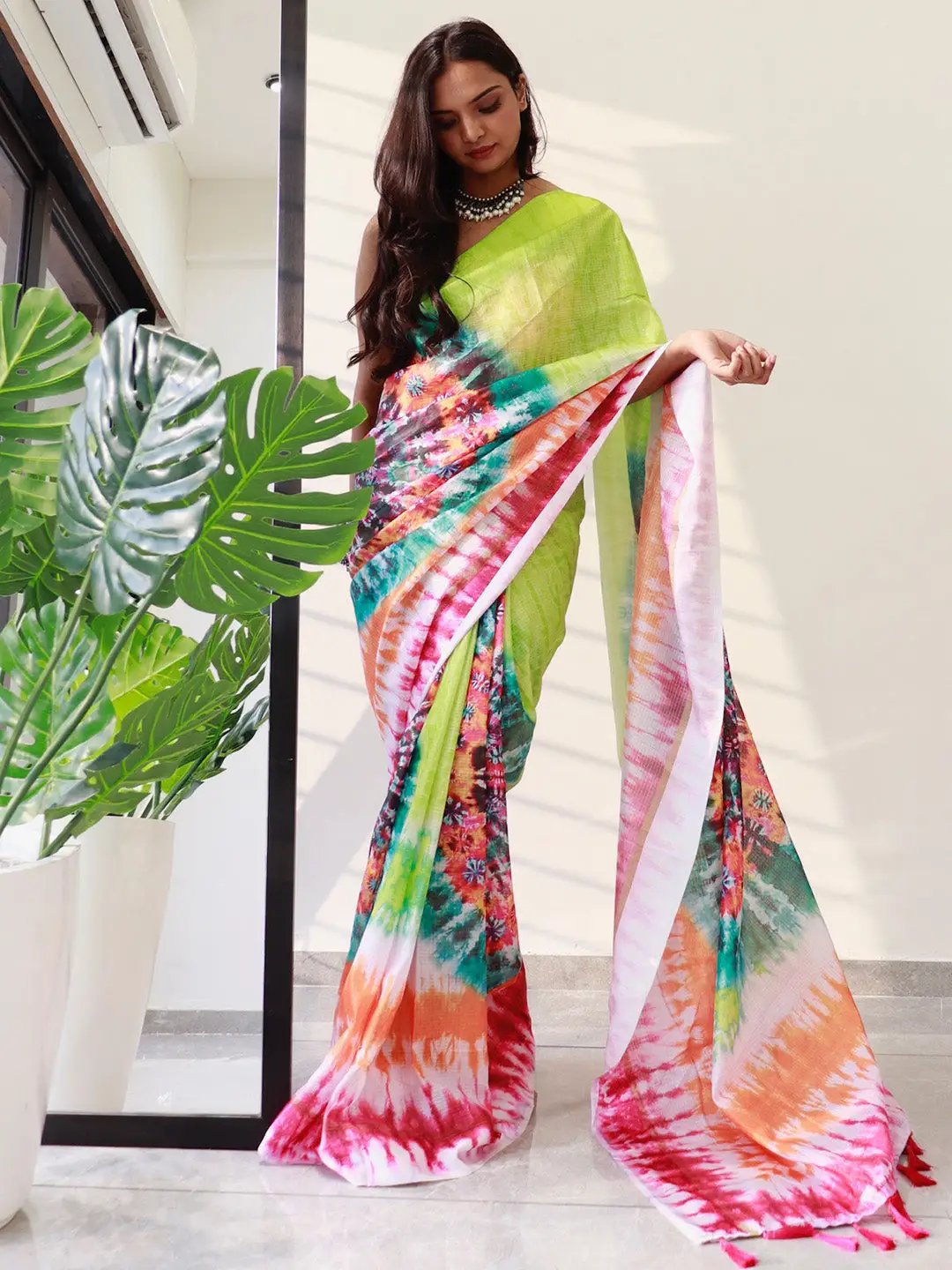 Model showcasing lime tie dye satin Kota Doriya saree
