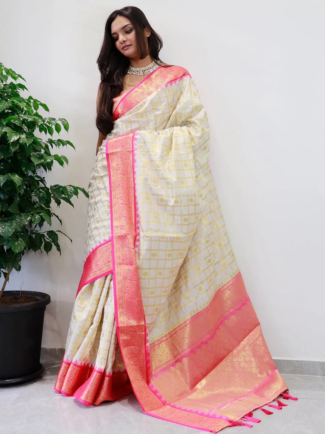 Soft silk Gadwal saree featuring intricate pink temple border.