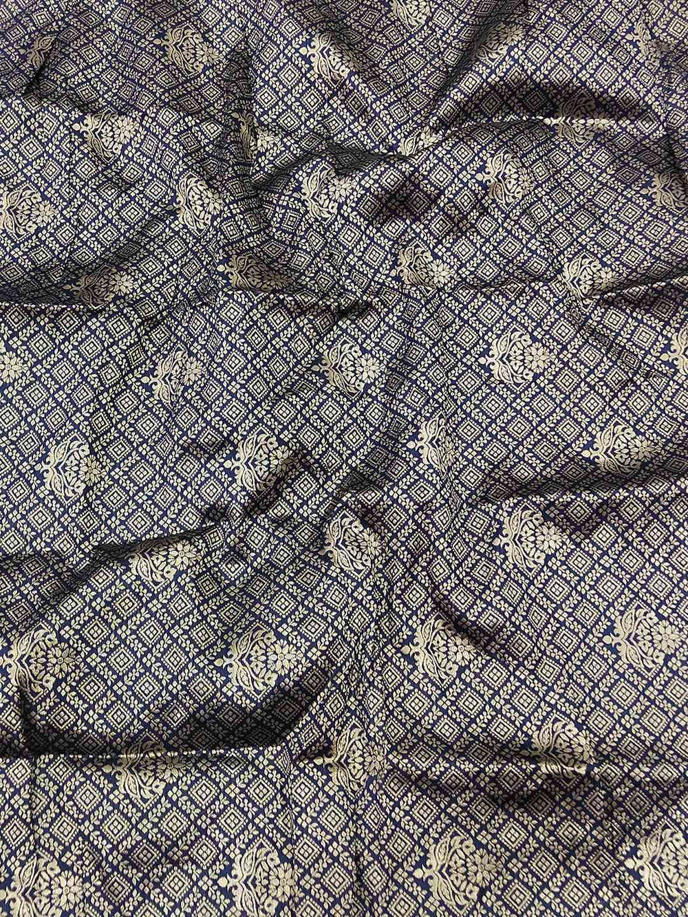 Close-up of intricate thread weaving on georgette fabric