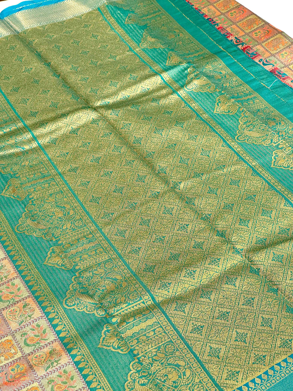 Sky Blue Animal Motif Saree With Gold Zari Border