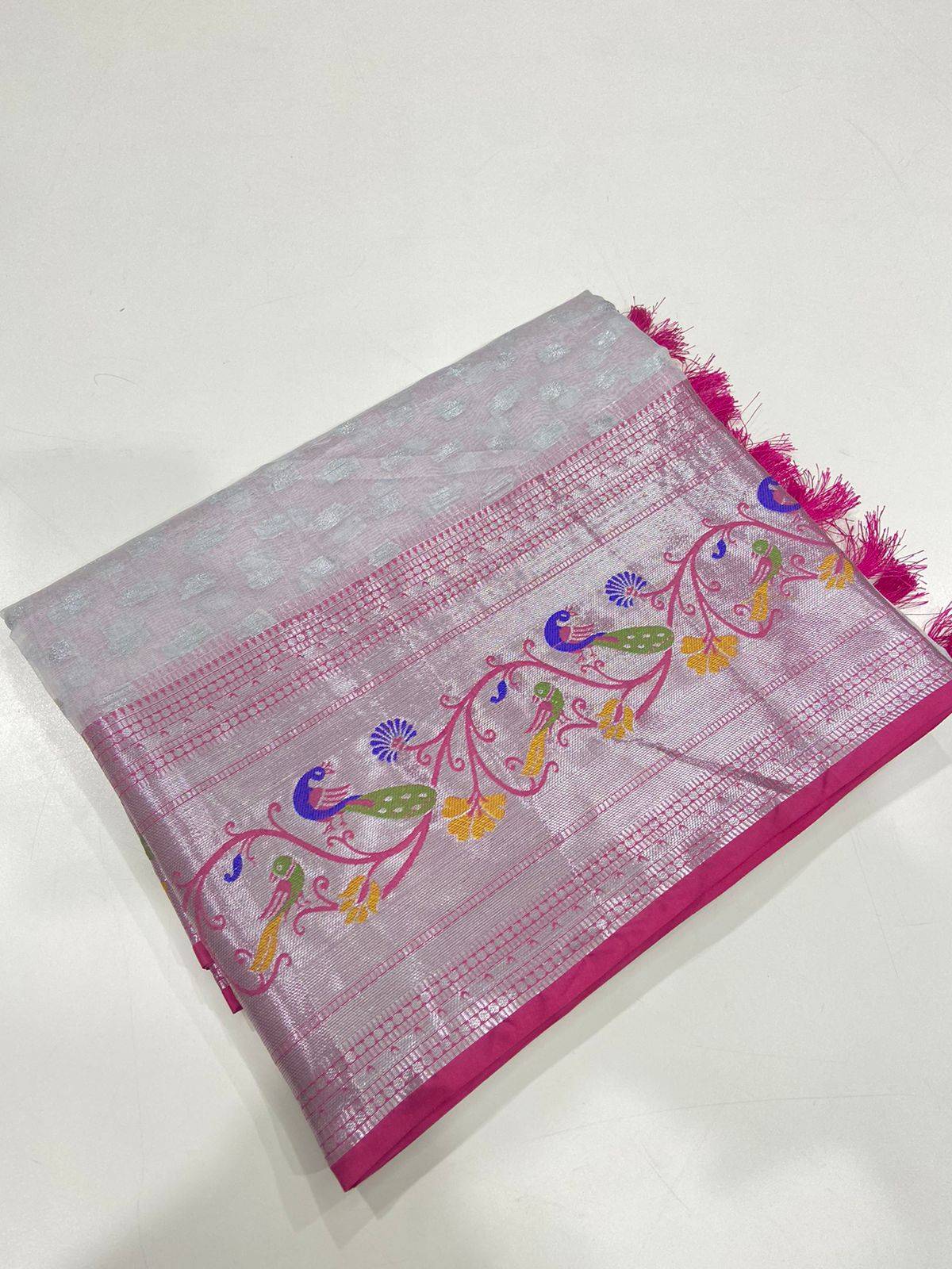 Folded white pink organza kasavu saree with silver zari butti