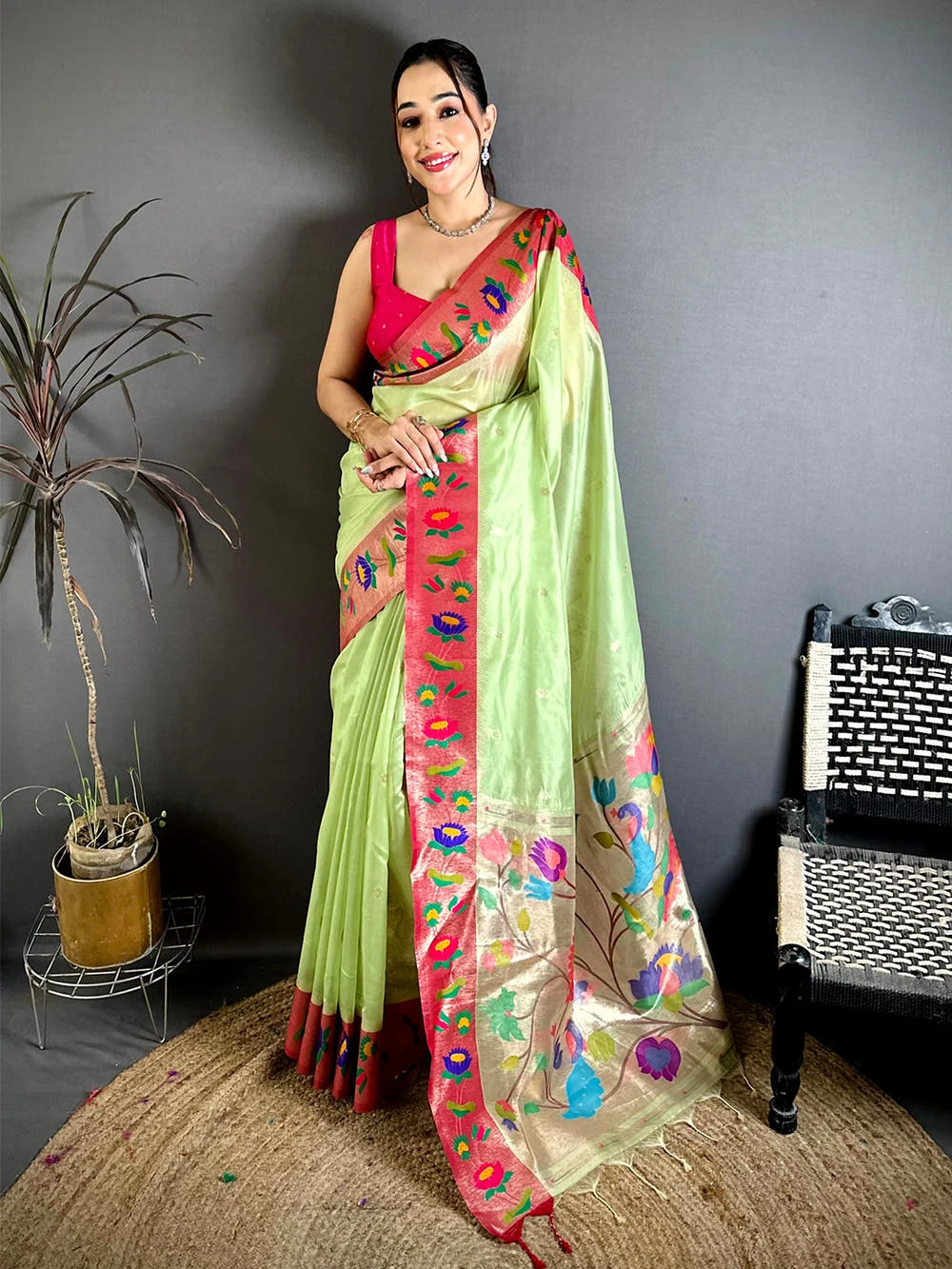 Pista green organza tissue Paithani minakari saree, full length front view of model standing on a jute rug