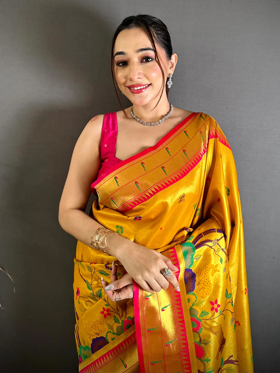 Mustard Soft Silk Paithani-style woven saree, front view on model showing woven birds, trees and pink border