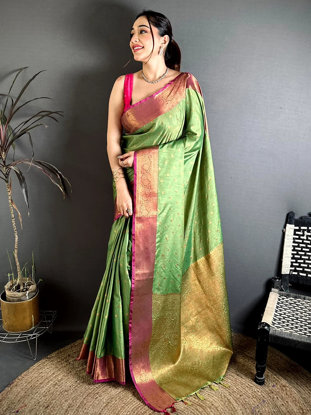 Pista Green Raw Silk woven buti saree, full length view of a model showing the zari pallu with tassels