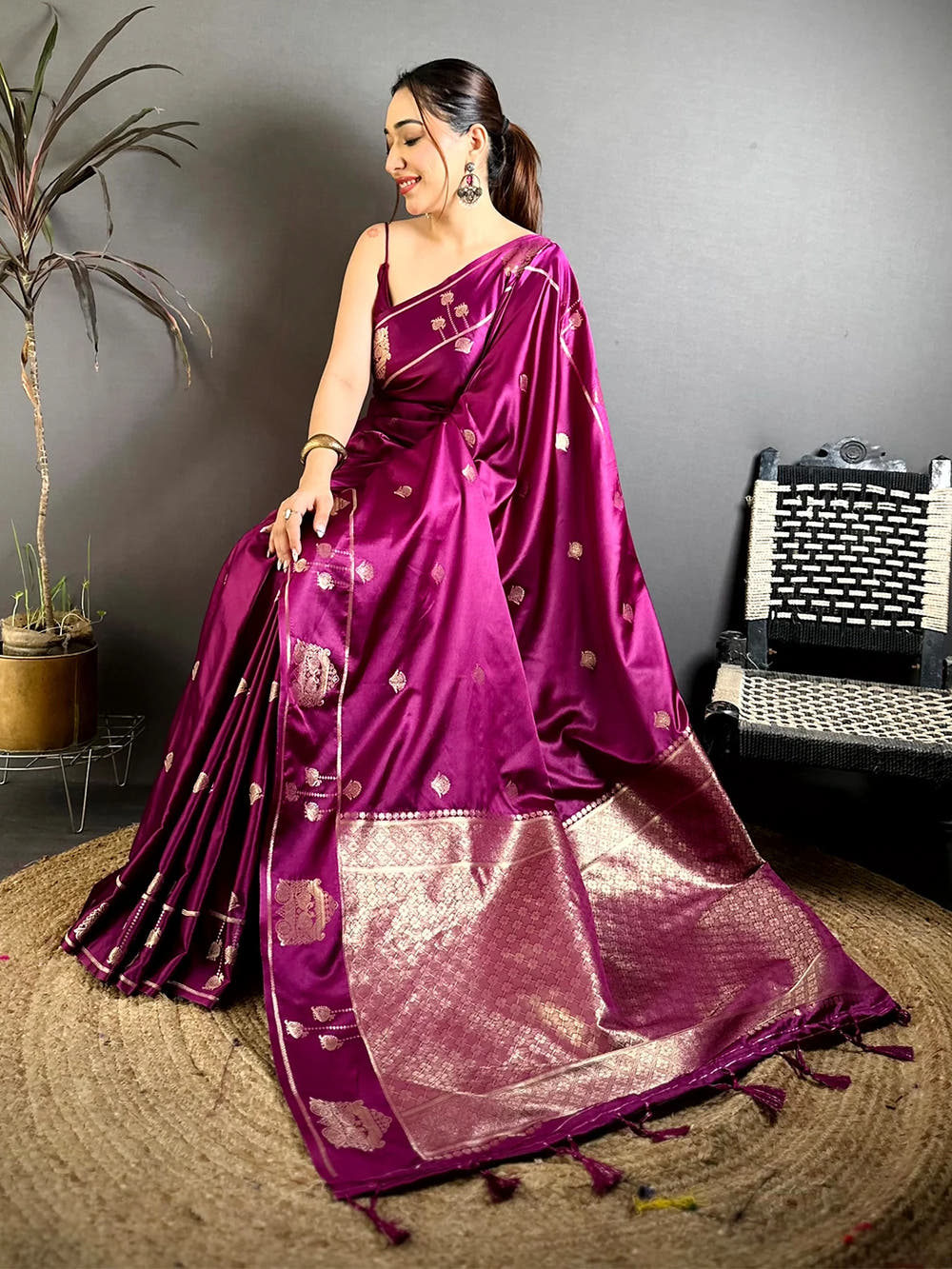 Wine Mashru Satin Silk peacock zari butta saree, pallu spread on the floor with geometric woven bands and tassels