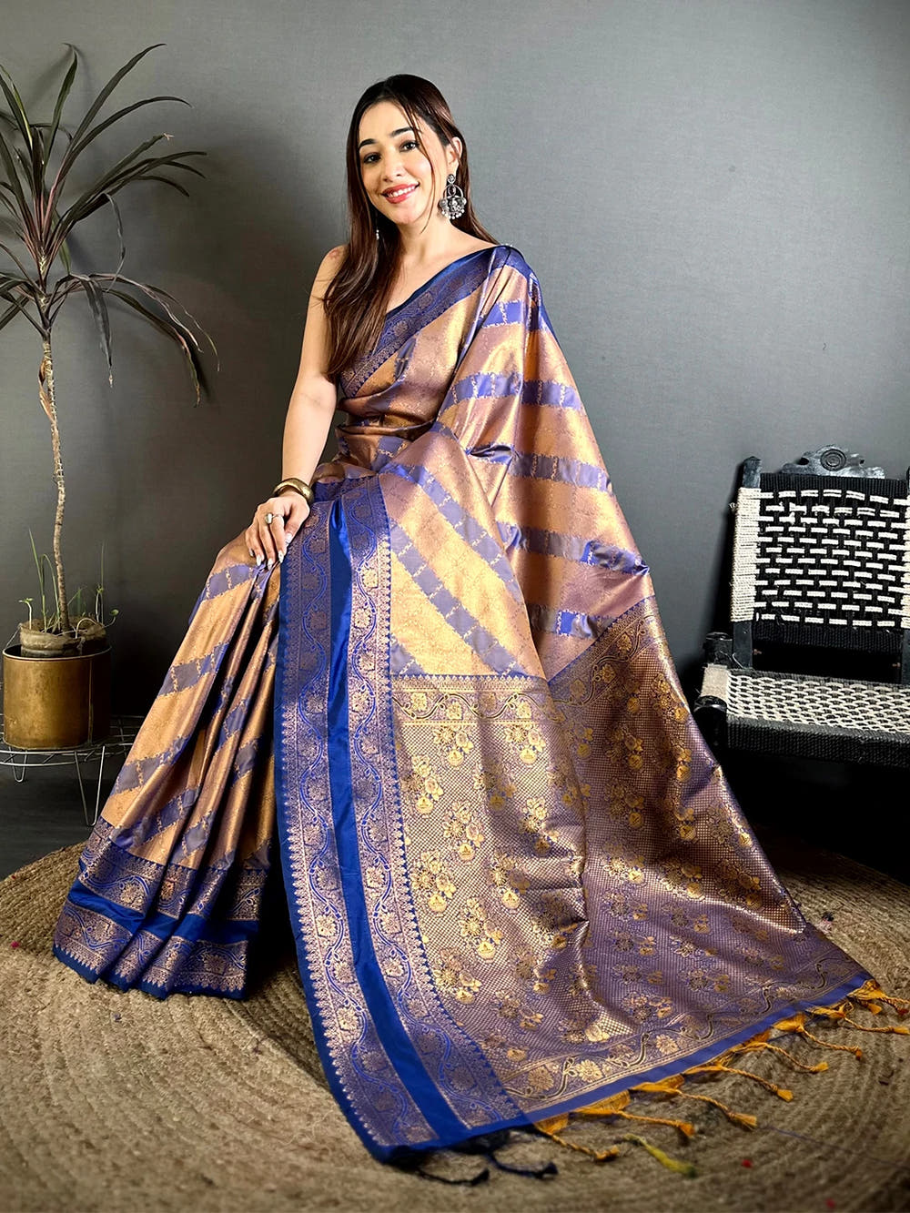 Royal Blue Kanchi Pattu lehriya zari weave saree, model with the zari-woven floral pallu and tassels spread on the floor
