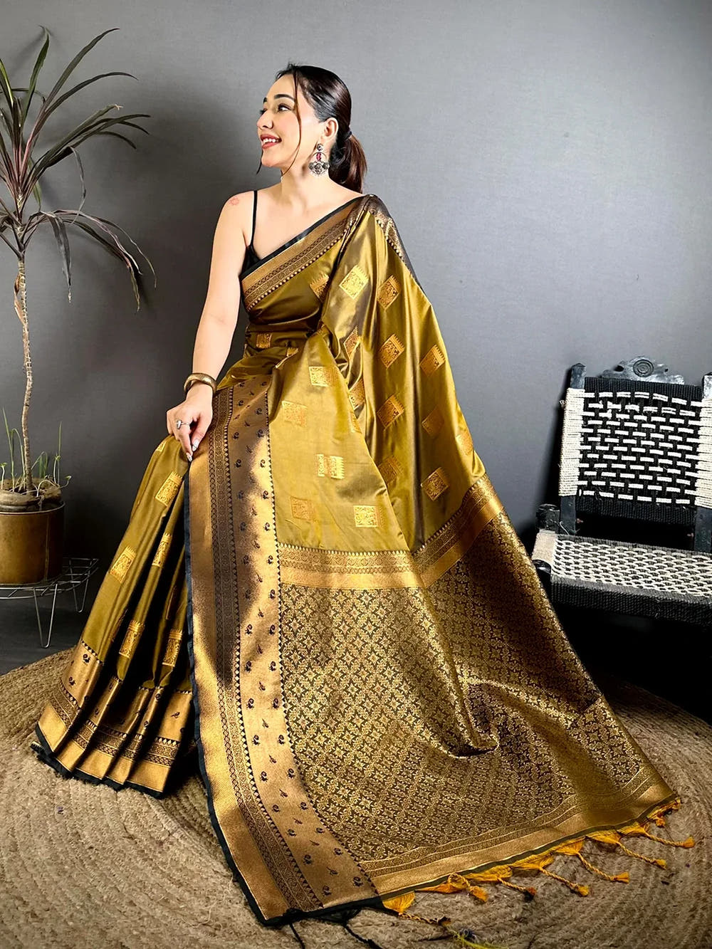 Mustard Katan Silk Peacock Cage Butti Saree, close view of the zari yevla border and woven pallu with tassels