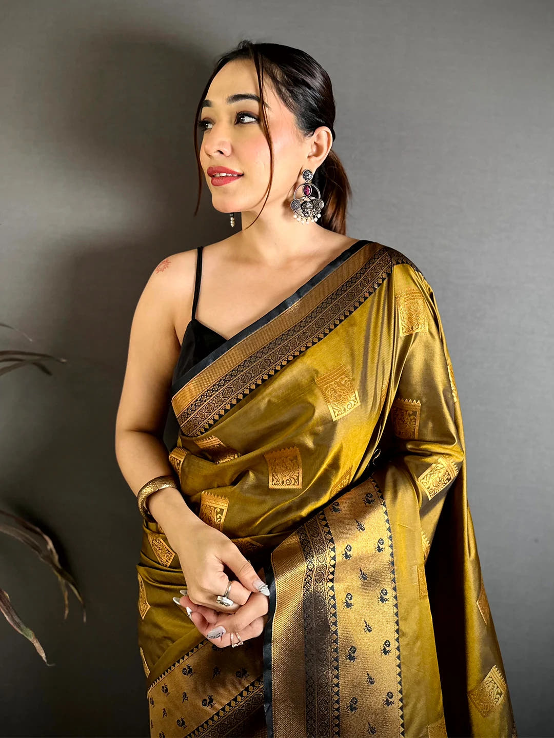 Mustard Katan Silk Peacock Cage Butti Saree, front drape on model with black blouse and gold-tone butti on the body